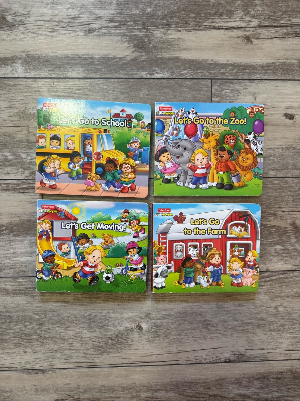 Fisher-Price Let's Go! Colorful Board Book Set - Blue, Green, Red, Yellow Covers